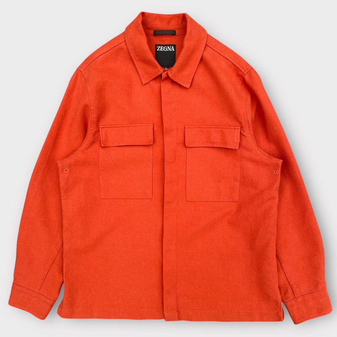 ZEGNA - Linen Overshirt Jacket Orange (Category: Coats, Jackets and Outerwear) located in Los Banos. Submitted by declutterking (Listing ID 1397521756, Image 2). Description: Size XL on tag Made in Italy from 100% linen, this soft long-sleeve overshirt is detailed with a classic collar and buttoned cuffs. Featuring a straight hem, this shirt is completed with flap pockets and concealed buttons. Dimensions: 17.5" shoulders 23" chest 29.5" length 2