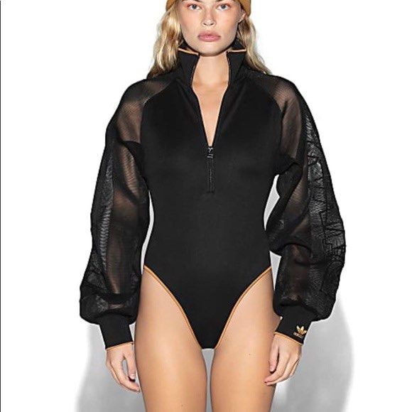 Adidas x Ivy Park Bodysuit (Category: Others Tops) located in Pasig City. Submitted by orlyspreloved (Listing ID 1397651254, Image 2). Description: - Black bodysuit - High neck and long sleeves - Front zipper - Mesh sleeves with Adidas logo - Gold trim on neckline and leg openings - Adidas logo on sleeve cuff.