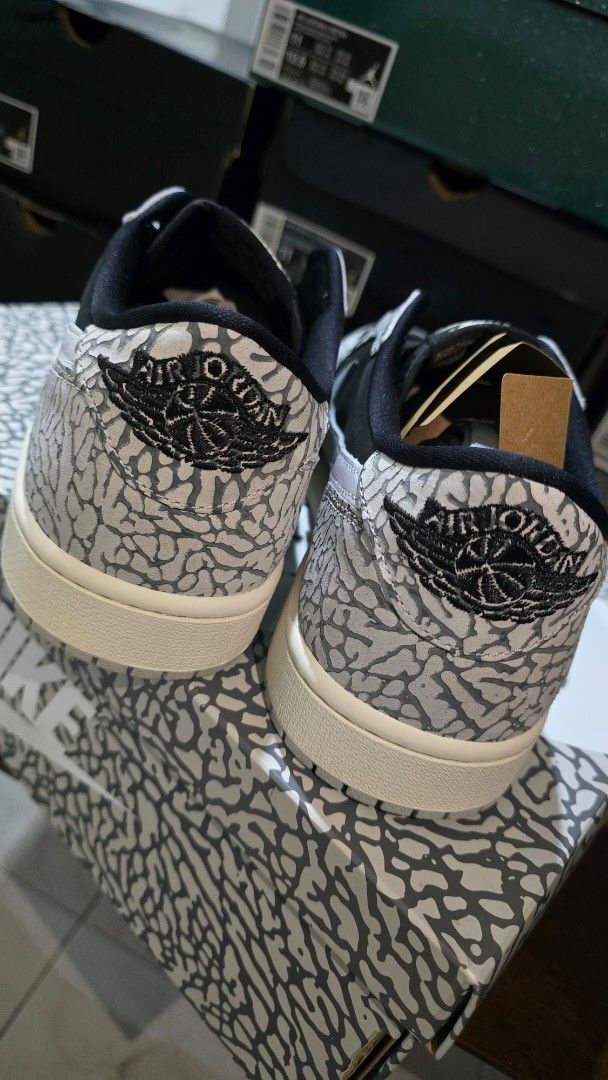 Air Jordan 1 Retro Low OG (Category: Sneakers) located in San Juan City. Submitted by aivveee (Listing ID 1397724518, Image 3). Description: - Air Jordan 1 Low - Elephant print design - Black and grey color scheme - White midsole - Nike swoosh visible - Comes with original box.