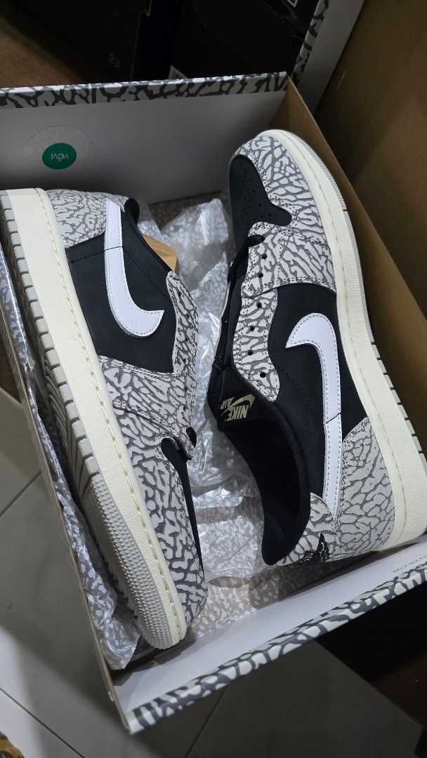 Air Jordan 1 Retro Low OG (Category: Sneakers) located in San Juan City. Submitted by aivveee (Listing ID 1397724518, Image 1). Description: - Air Jordan 1 Low - Elephant print design - Black and grey color scheme - White midsole - Nike swoosh visible - Comes with original box.