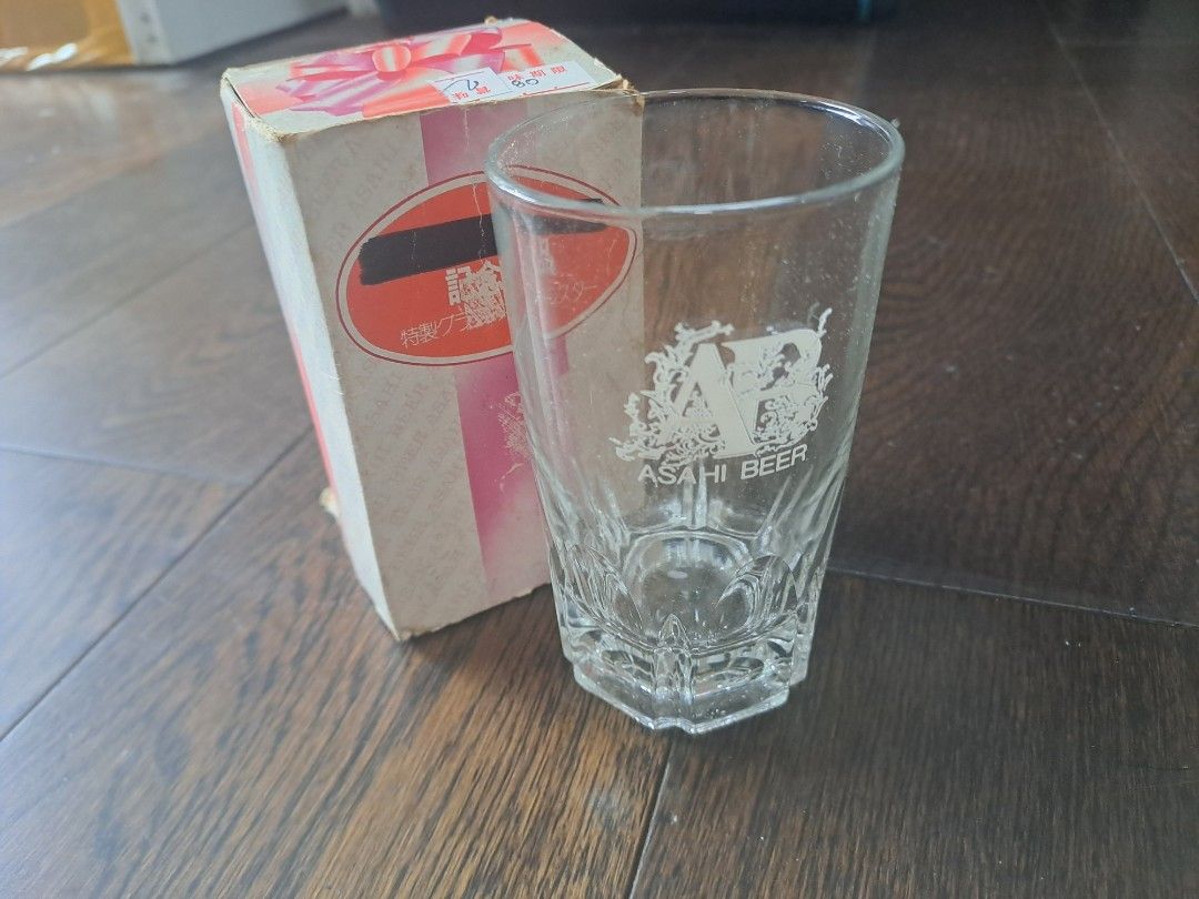 Asahi Beer Glass with Box (Category: Other Kitchenware & Tableware) located in Manila. Submitted by joanbalde39643 (Listing ID 1397631775, Image 1). Description: - Vintage Asahi Beer glass - Includes original box - Features Asahi Beer logo - Box has Japanese text and a pink/white design - Unique faceted base - Ideal for glassware collectors - Great gift for beer enthusiasts.