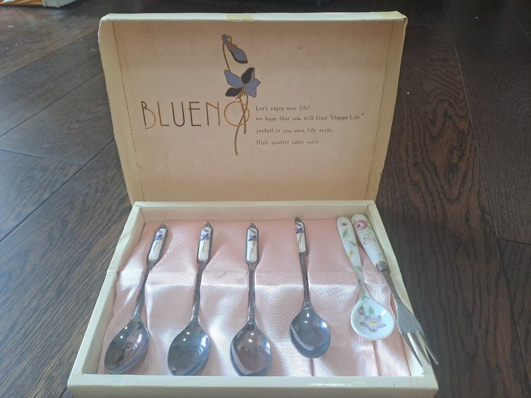 BLUENO Spoon and Fork Set (Category: Dinnerware & Cutlery) located in Manila. Submitted by joanbalde39643 (Listing ID 1397629620, Image 2). Description: - Vintage BLUENO spoon and fork set - Includes 5 spoons and 1 fork - Decorative handles - Silver finish with floral and patterned accents - Comes in original box - Box features floral design and brand name - Box text: "Let's enjoy new life...".