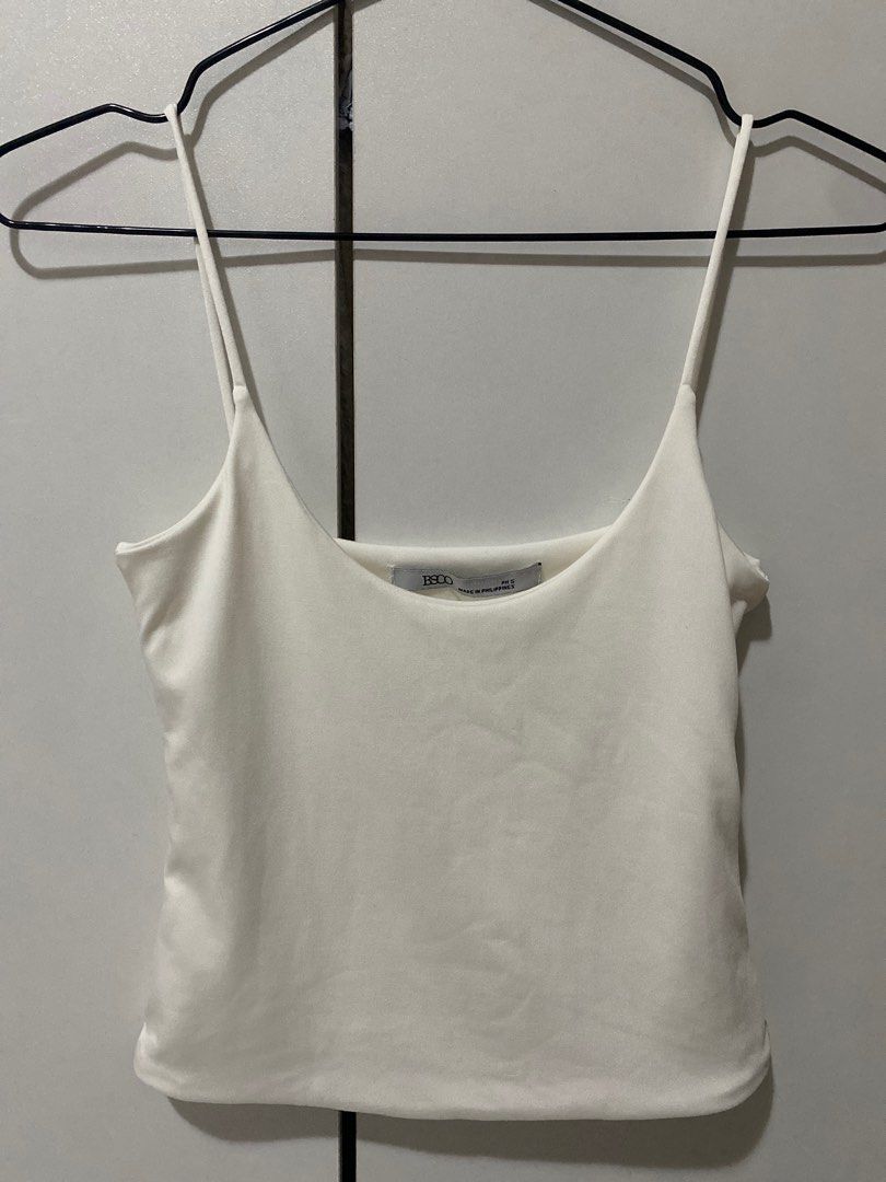 BSCO White Camisole Top (Category: Sleeveless) located in Manila. Submitted by helpherdeclutter (Listing ID 1397612889, Image 1). Description: - BSCO white camisole top - Size: S - Made in the Philippines - Features a scoop neckline - Spaghetti straps - Versatile and easy to pair - Perfect for layering.