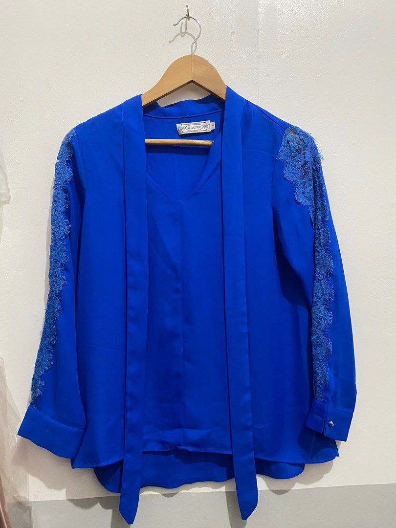 Calypso Blue Blouse with Lace Sleeves (Category: Blouses) located in Manila. Submitted by zapitup (Listing ID 1397703644, Image 1). Description: - Calypso blue blouse - Lace detailing on sleeves - V-neck design - Long sleeves - Tie detail at neckline - Size: Small - Suitable for casual and formal wear.