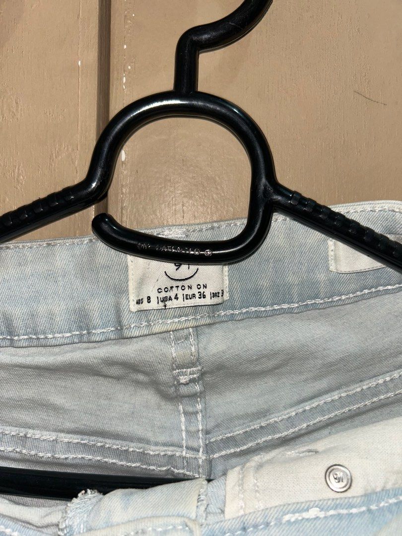 Cotton On Denim Shorts - Size 4 (Category: Shorts) located in Manila. Submitted by fwance (Listing ID 1397618101, Image 2). Description: - Cotton On denim shorts - Light blue color - Size 4, waist 36 - Button and zipper closure - Two front and two back pockets - Cuffed hem - White stitching details.