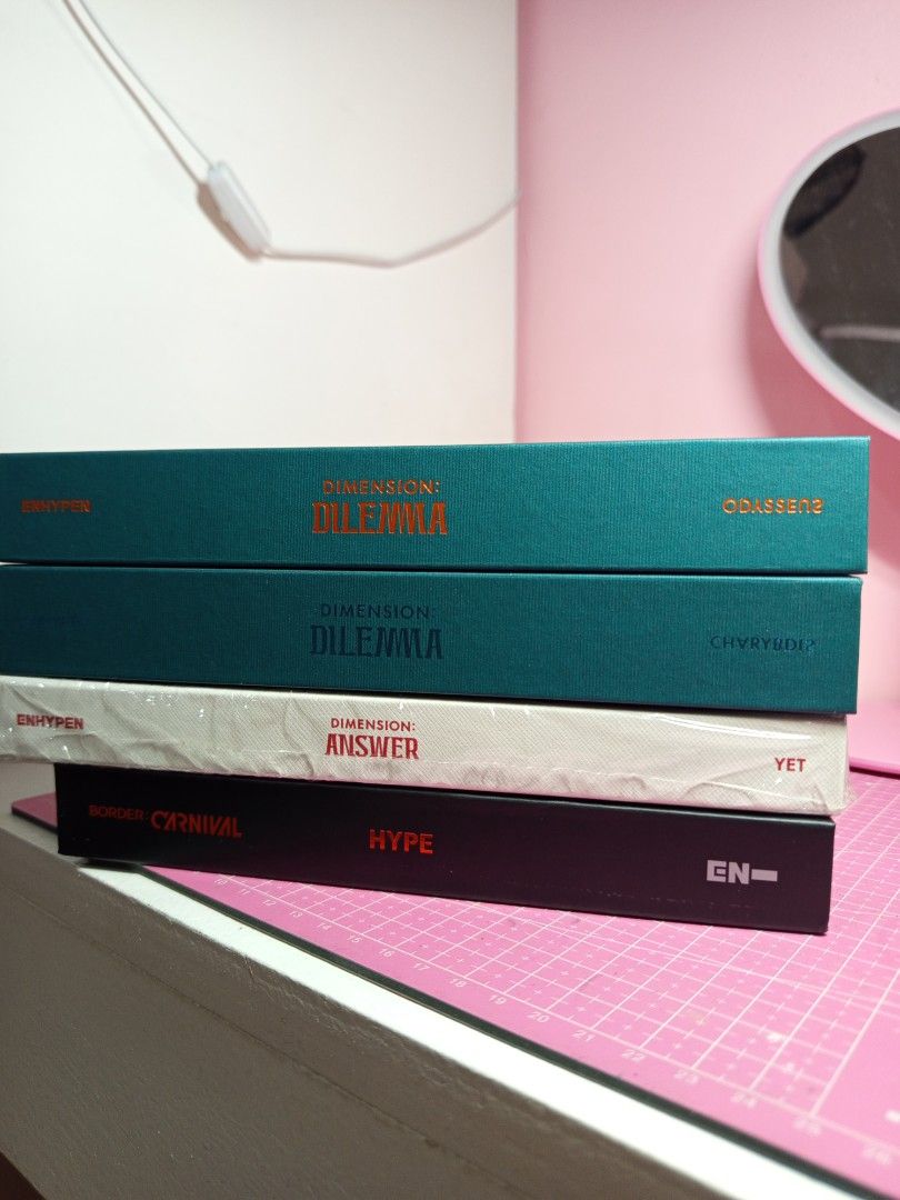 ENHYPEN unsealed albums (Category: CDs & DVDs) located in Pasig City. Submitted by nicka_nicks (Listing ID 1397629548, Image 2). Description: ~ 170ea (free packaging) ~ all in mint condition ~ firsthand owner ~ no posters for bc and answer Dillema Charybdis sold.