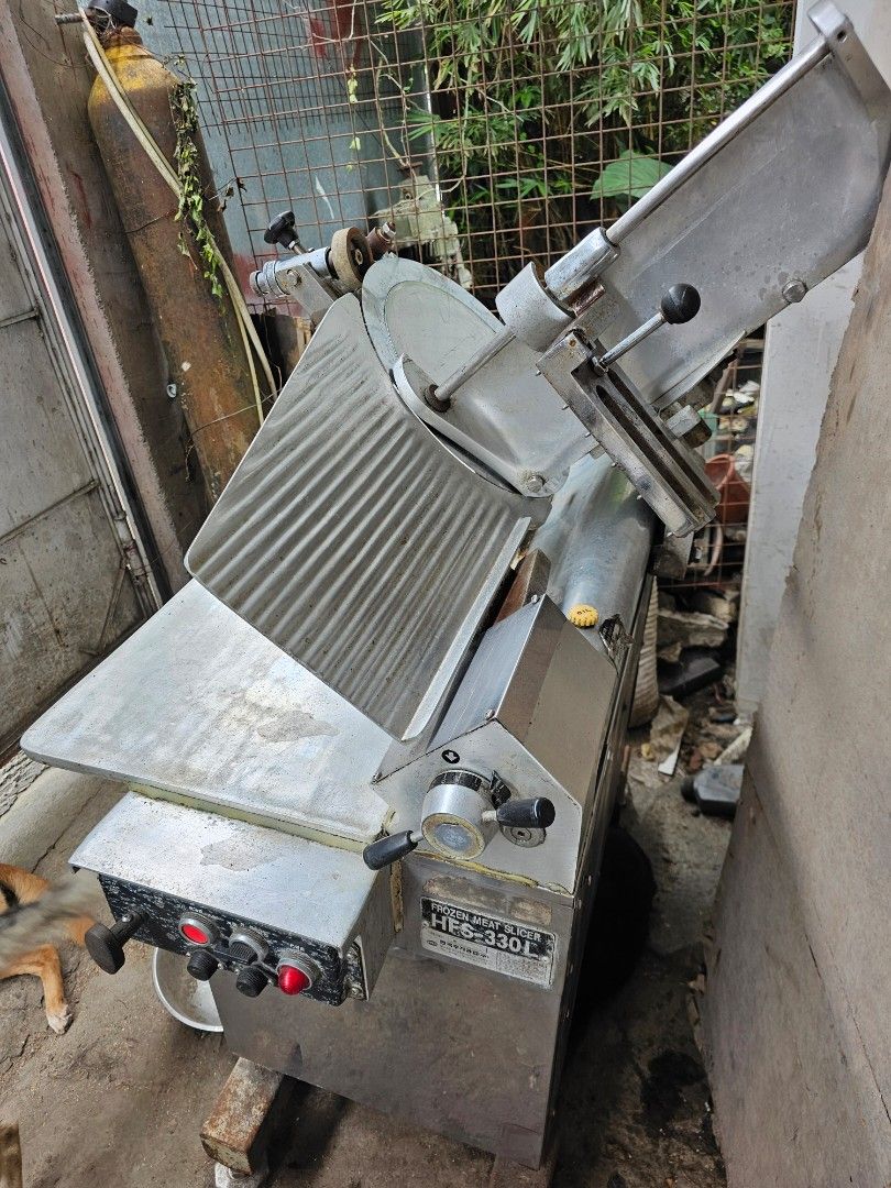 Frozen Meat Slicer HFS-330L (Category: Other Kitchen Appliances) located in Tagbilaran City. Submitted by lugarpogi (Listing ID 1397639912, Image 2). Description: - Model: HFS-330L - Designed for slicing frozen meat. - Features a large circular blade. - Includes a sliding tray for easy slicing. - Made of stainless steel. - Integrated blade sharpener. - Control panel with Korean characters..