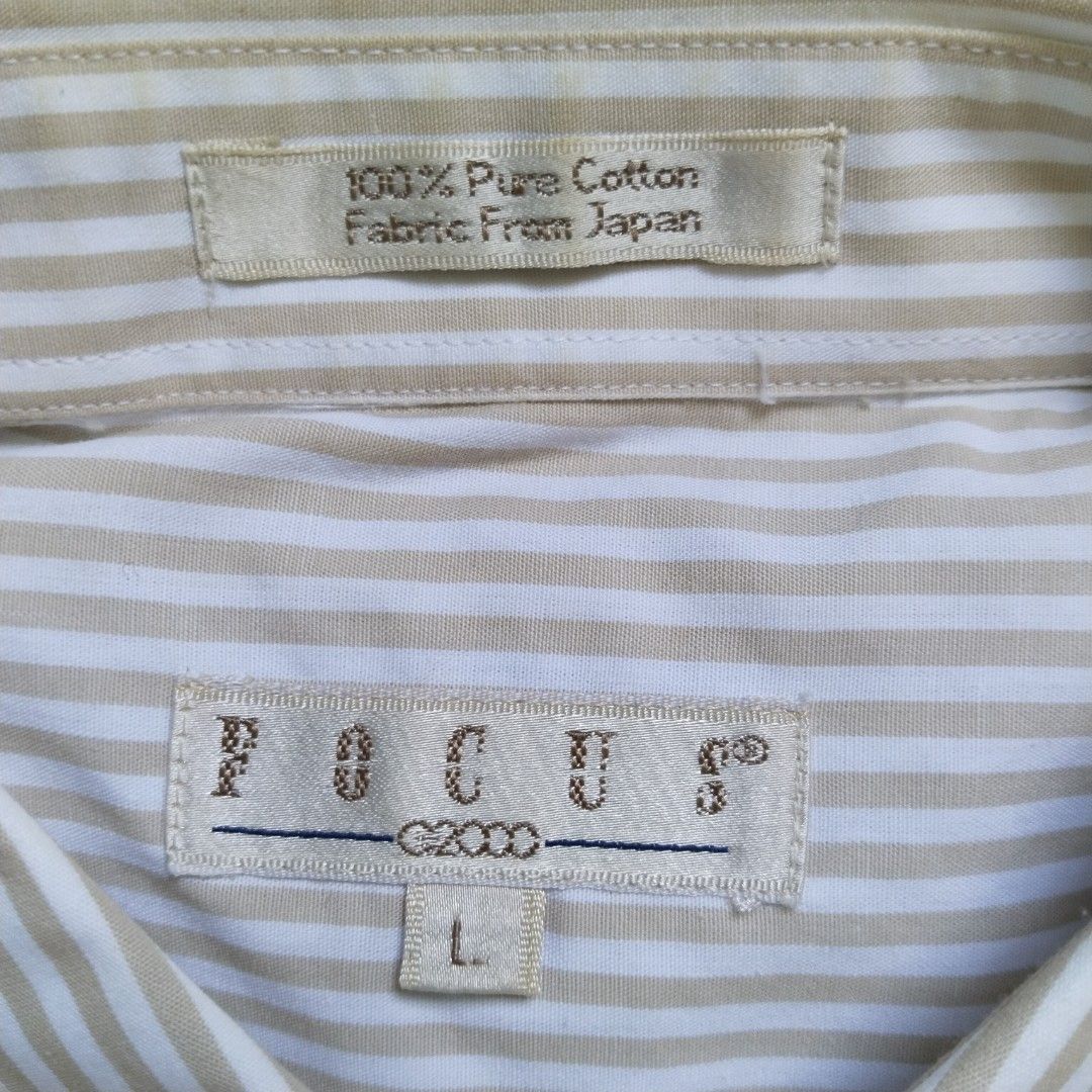 G2000 | Striped Button-down shirt (Category: Formal Shirts) located in Batangas. Submitted by second_cycle (Listing ID 1397641296, Image 2). Description: •100% cotton from Japan (on tag) •white fabric w/ light brown candy stripes •18" shoulders •22.5" width •23.5" sleeves •32" length from collar •button-down collar lightly worn, oversized on me but no longer worn much ✅ no rips or loose threads ✅ no stains; original buttons 🫧 recently washed and
