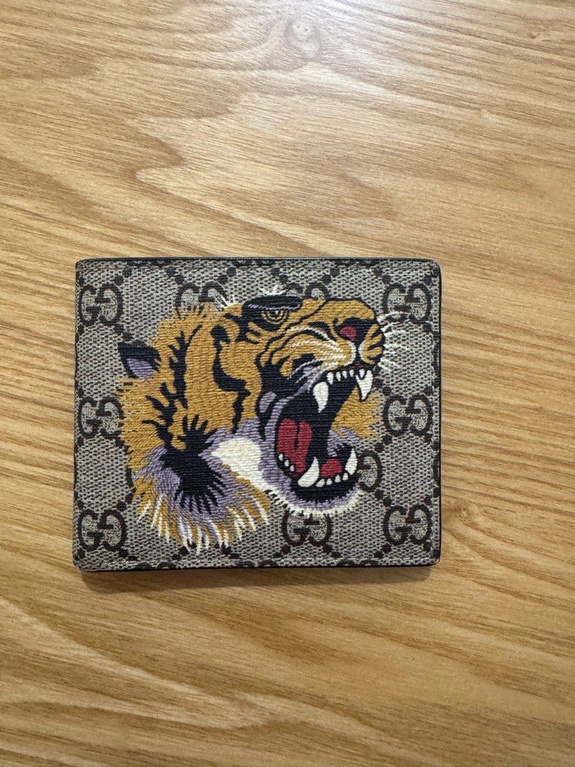 Gucci Bengal Tiger print Wallet Men (Category: Luxury Bags & Wallets) located in Pasig City. Submitted by juwlgaga (Listing ID 1397660617, Image 1). Description: Gucci Bengal Tiger print - classic and screaming gucci for those who are maximalists!! Mens fold wallet. No inclusions, wallet only. Message me 🤍 meetup, or own courier 🤠.
