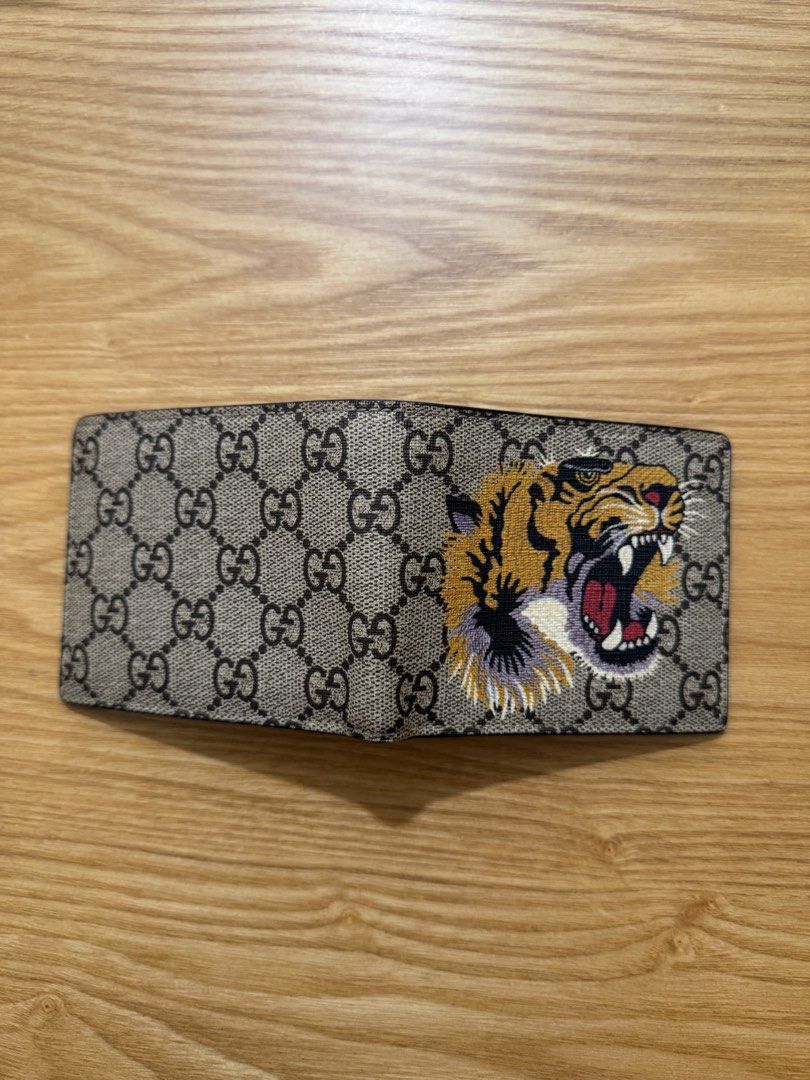Gucci Bengal Tiger print Wallet Men (Category: Luxury Bags & Wallets) located in Pasig City. Submitted by juwlgaga (Listing ID 1397660617, Image 2). Description: Gucci Bengal Tiger print - classic and screaming gucci for those who are maximalists!! Mens fold wallet. No inclusions, wallet only. Message me 🤍 meetup, or own courier 🤠.