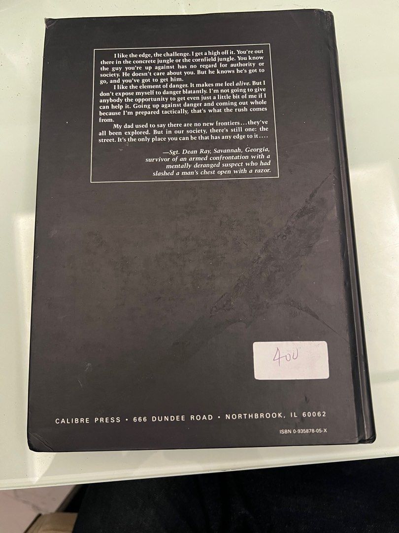HARDBOUND The Tactical Edge: Surviving High-Risk Patrol (Category: Storybooks) located in Manila. Submitted by cococrunch13 (Listing ID 1397712502, Image 2). Description: - "The Tactical Edge: Surviving High-Risk Patrol" by Charles Remsberg - Published by Calibre Press - Focuses on street survival tactics - Features a cover with a silhouette - Includes a quote and publisher's address on the back.