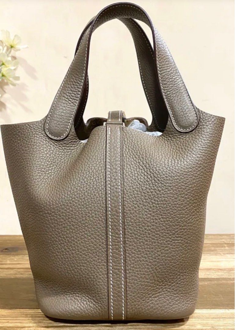 Hermes Picotin 18 Etoupe SHW (Category: Luxury Bags & Wallets) located in Quezon City. Submitted by __12345 (Listing ID 1397766019, Image 2). Description: - Preorder (2 weeks eta) - 9.5/10 very good condition - Stamp D - Includes dustbag, box, lock & key, and entrupy - Available for meet ups/delivery - Detailed photos available upon request - Guaranteed authentic or money back! Open to sourcing requests! DM us the item you want and we can source 