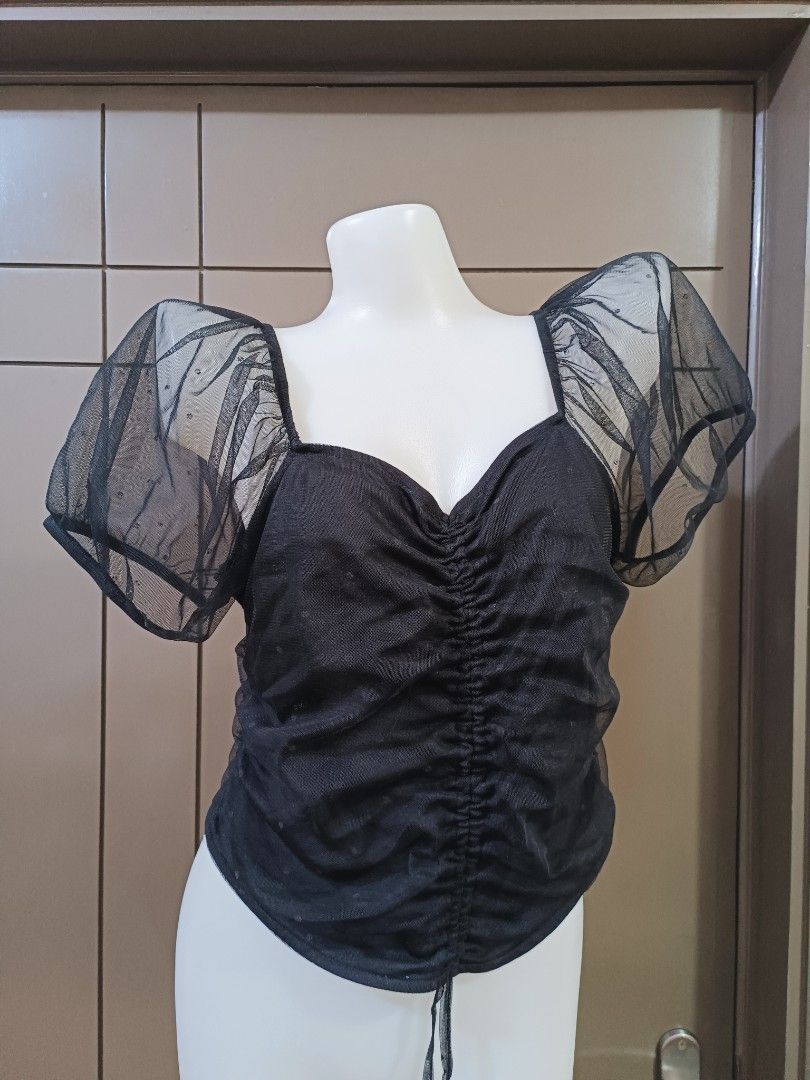 H&M Black Puff Sleeve Top (Category: Blouses) located in Manila. Submitted by margaretttgo (Listing ID 1397652288, Image 1). Description: - Black top - Sweetheart neckline - Ruched detailing - Sheer puff sleeves with dotted pattern - Tie at the bottom - Size M.