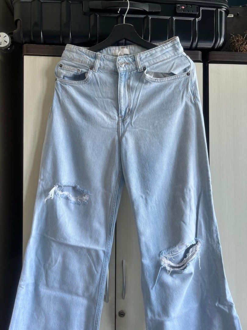 H&M Distressed Wide Leg Jeans (Category: Jeans) located in Makati City. Submitted by gabj6 (Listing ID 1397607951, Image 1). Description: - H&M light wash wide leg jeans - Distressed details on the knees - Size: US 6, CA 6 - Classic five-pocket design - Button and zipper closure - Great for casual wear.