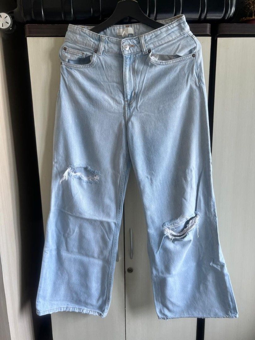 H&M Distressed Wide Leg Jeans (Category: Jeans) located in Makati City. Submitted by gabj6 (Listing ID 1397607951, Image 2). Description: - H&M light wash wide leg jeans - Distressed details on the knees - Size: US 6, CA 6 - Classic five-pocket design - Button and zipper closure - Great for casual wear.