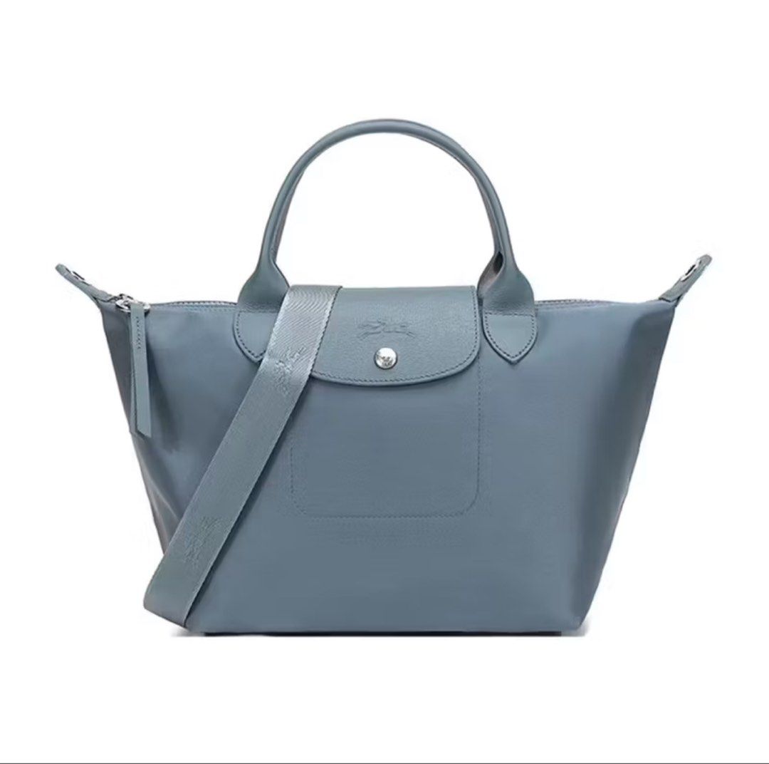 Longchamp Le Pliage Neo Medium Nylon Shoulder Bag (Category: Luxury Bags & Wallets) located in Manila. Submitted by hellothere2012 (Listing ID 1397660744, Image 1). Description: New without tag and care card Longchamp debuts an all-new iteration of its much-loved Le Pliage tote: the Neo pairs textured leather trim with the French house’s signature lightweight nylon in coordinating shades for a sleek, monochromatic look. With a spacious interior a