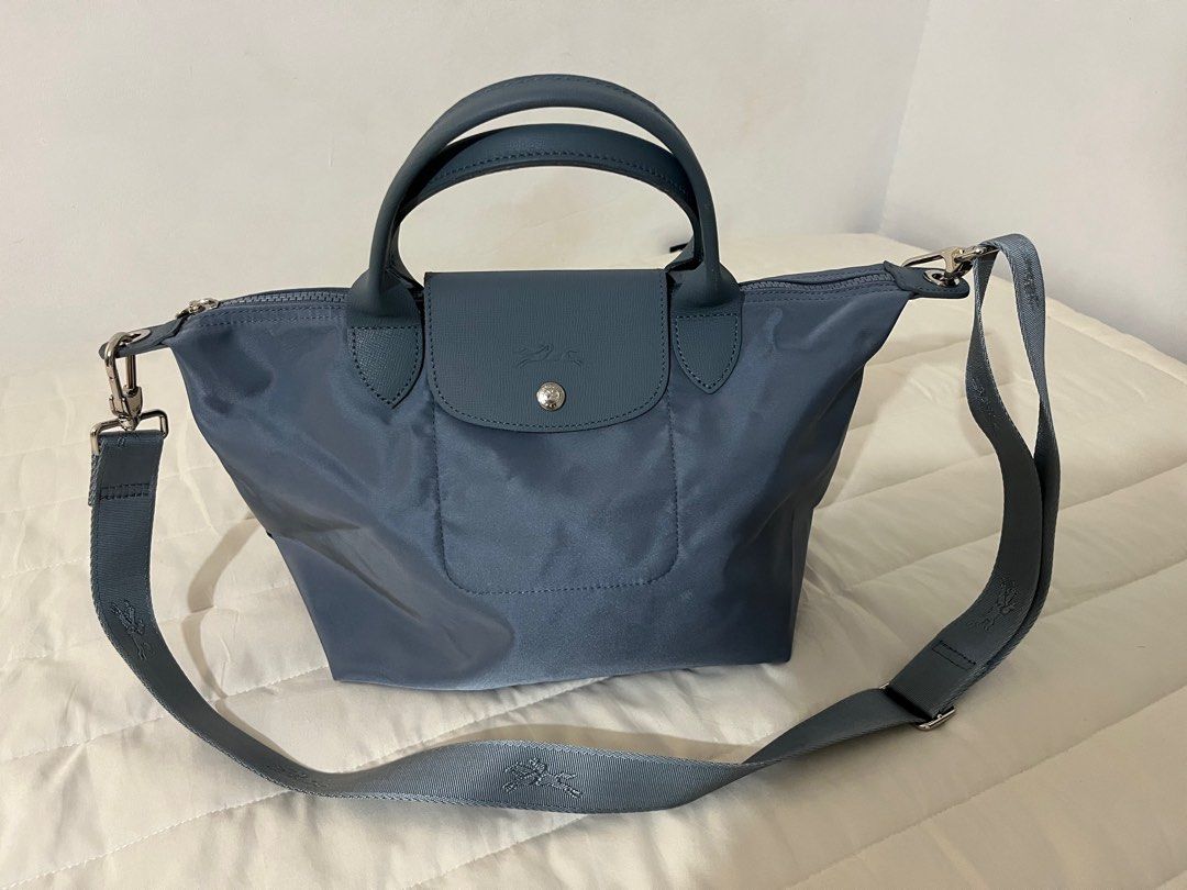 Longchamp Le Pliage Neo Medium Nylon Shoulder Bag (Category: Luxury Bags & Wallets) located in Manila. Submitted by hellothere2012 (Listing ID 1397660744, Image 3). Description: New without tag and care card Longchamp debuts an all-new iteration of its much-loved Le Pliage tote: the Neo pairs textured leather trim with the French house’s signature lightweight nylon in coordinating shades for a sleek, monochromatic look. With a spacious interior a