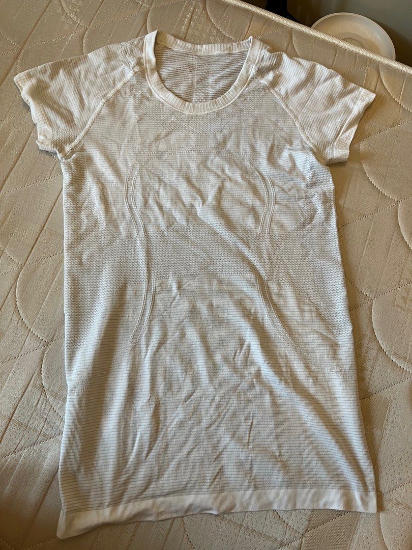 Lululemon Swiftly Tech Short Sleeve Shirt (Category: Activewear) located in Quezon City. Submitted by krtstn (Listing ID 1397657490, Image 1). Description: - Lululemon Swiftly Tech short sleeve shirt - Color: White - Crew neck - Seamless design - Fitted silhouette - Textured pattern - Lululemon logo on back - Short sleeves - Straight hemline.