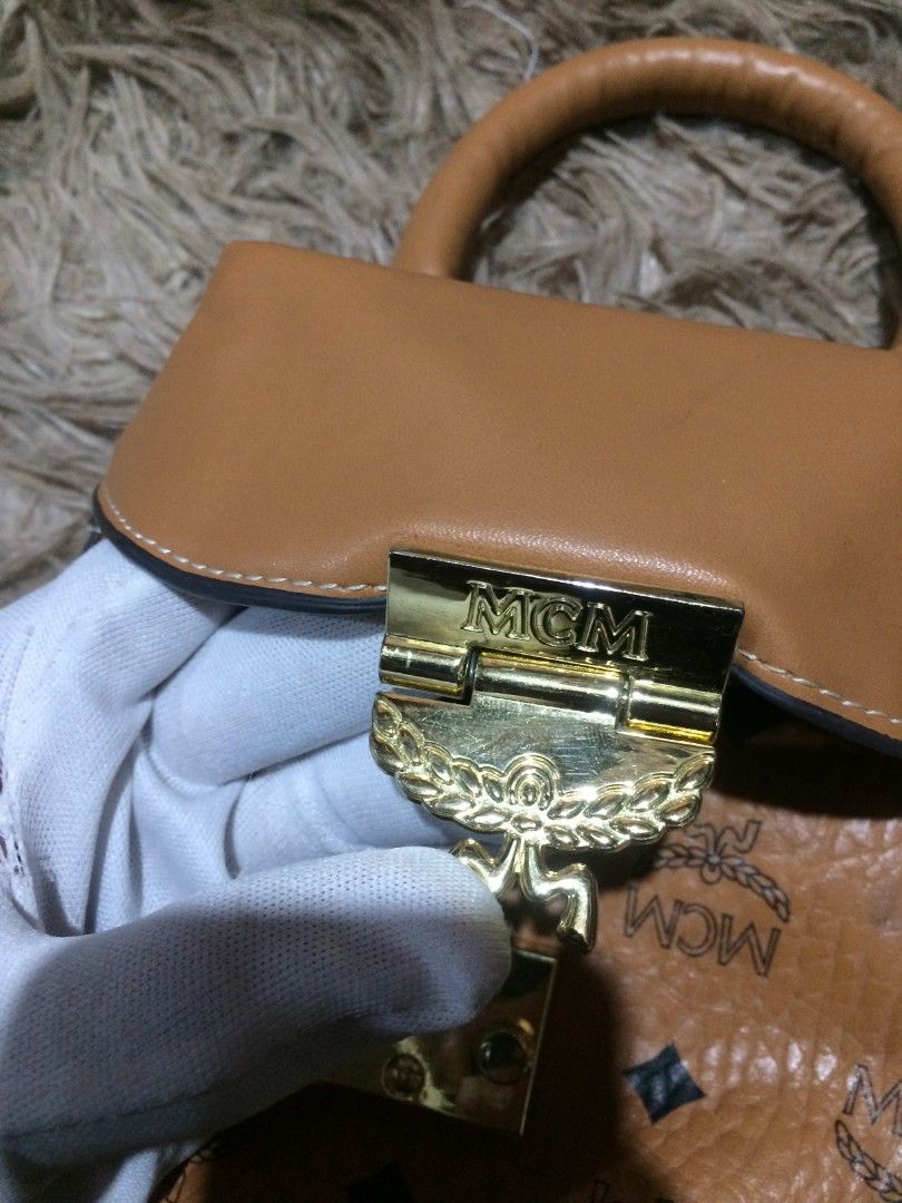 MCM MINI POUCH BAG (Category: Luxury Bags & Wallets) located in Naga. Submitted by mojojojooohitzzz (Listing ID 1397743794, Image 3). Description: Size : small Color rate : 10/10 Issue : none Excellent Condition Location : Bicol Naga City MOP: Gcash only ( Payment First ) Courier : J&T Express.