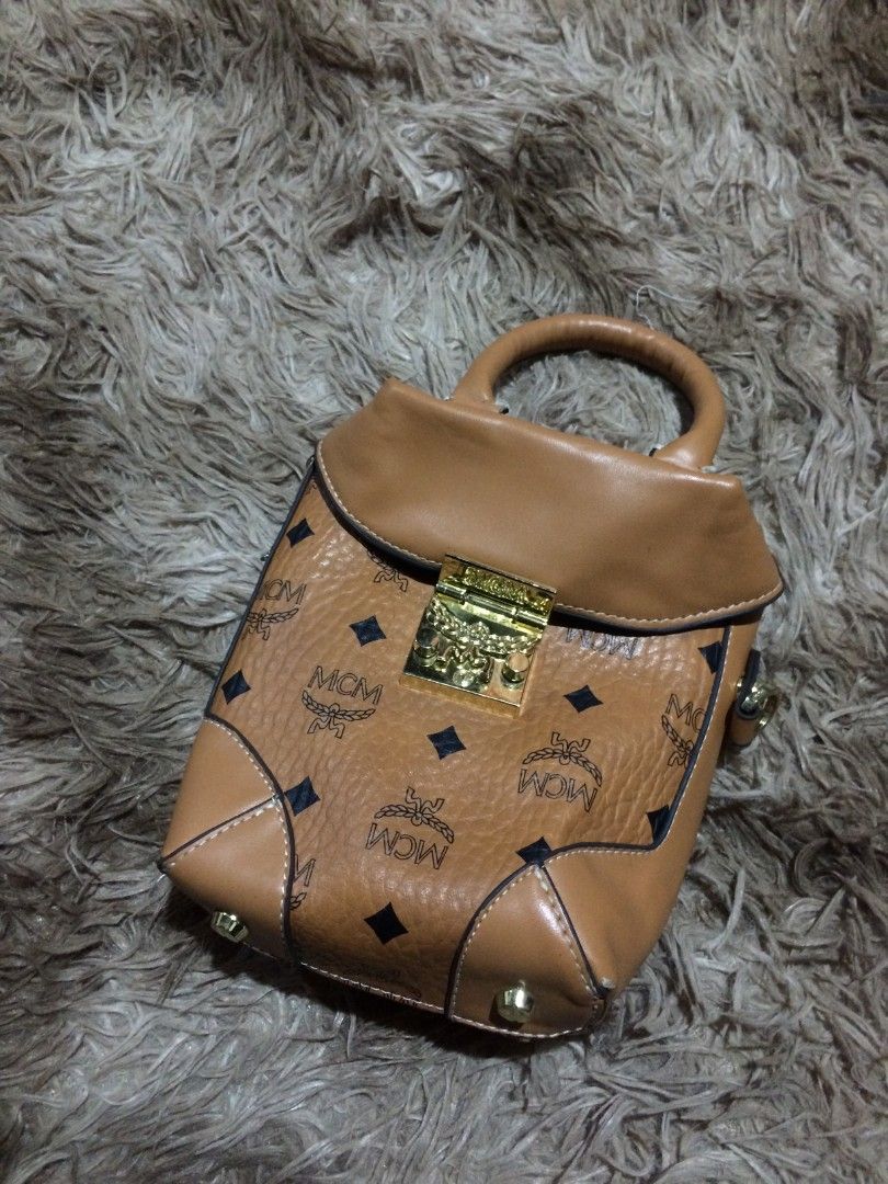 MCM MINI POUCH BAG (Category: Luxury Bags & Wallets) located in Naga. Submitted by mojojojooohitzzz (Listing ID 1397743794, Image 1). Description: Size : small Color rate : 10/10 Issue : none Excellent Condition Location : Bicol Naga City MOP: Gcash only ( Payment First ) Courier : J&T Express.