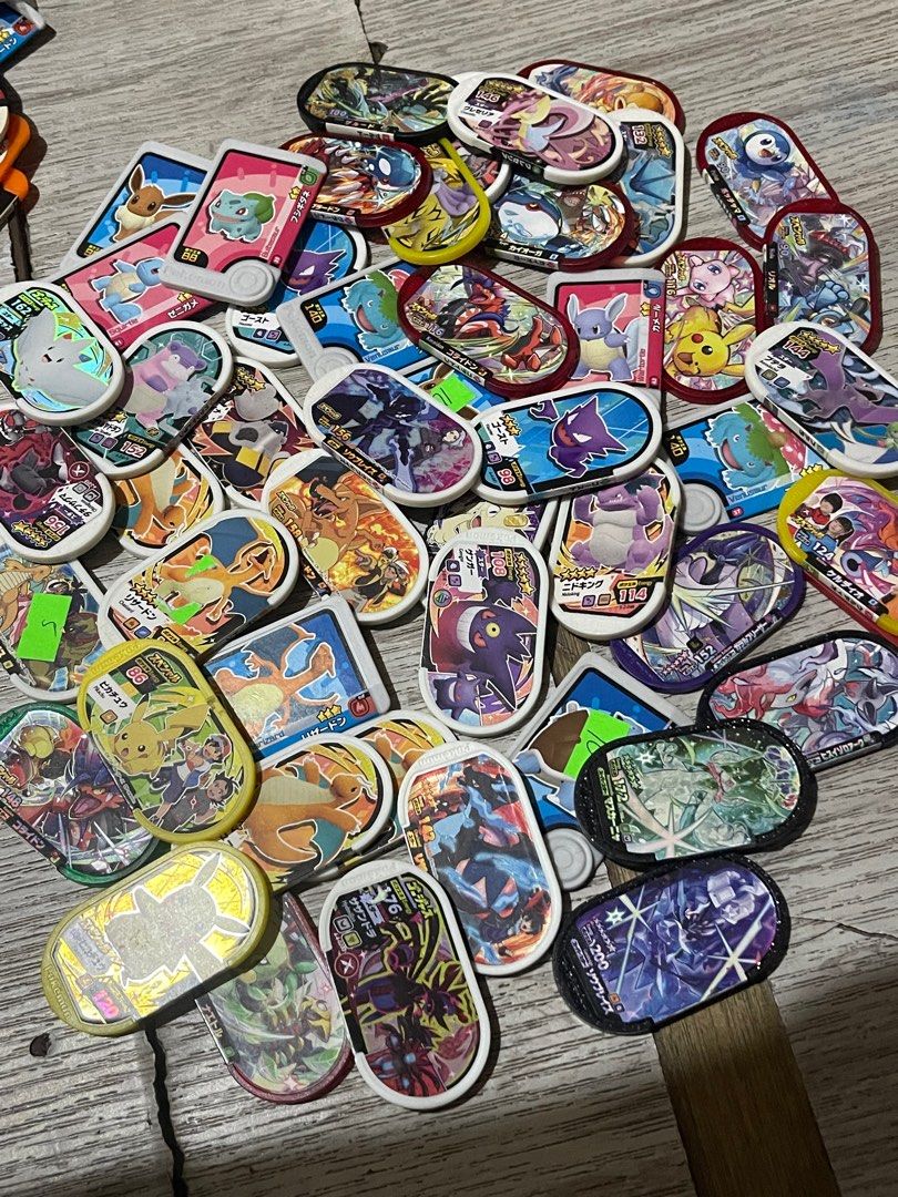 Pokemon Medallions Collection & chips (Category: Nintendo) located in Manila. Submitted by kwwvjv7zcw85597 (Listing ID 1397775172, Image 2). Description: - Pokemon Medallion Collection - Features various Pokemon characters (Pikachu, Eevee, etc.) - Includes medallions with different designs and colors - Some medallions have Japanese text (pokemon chips and coin) .