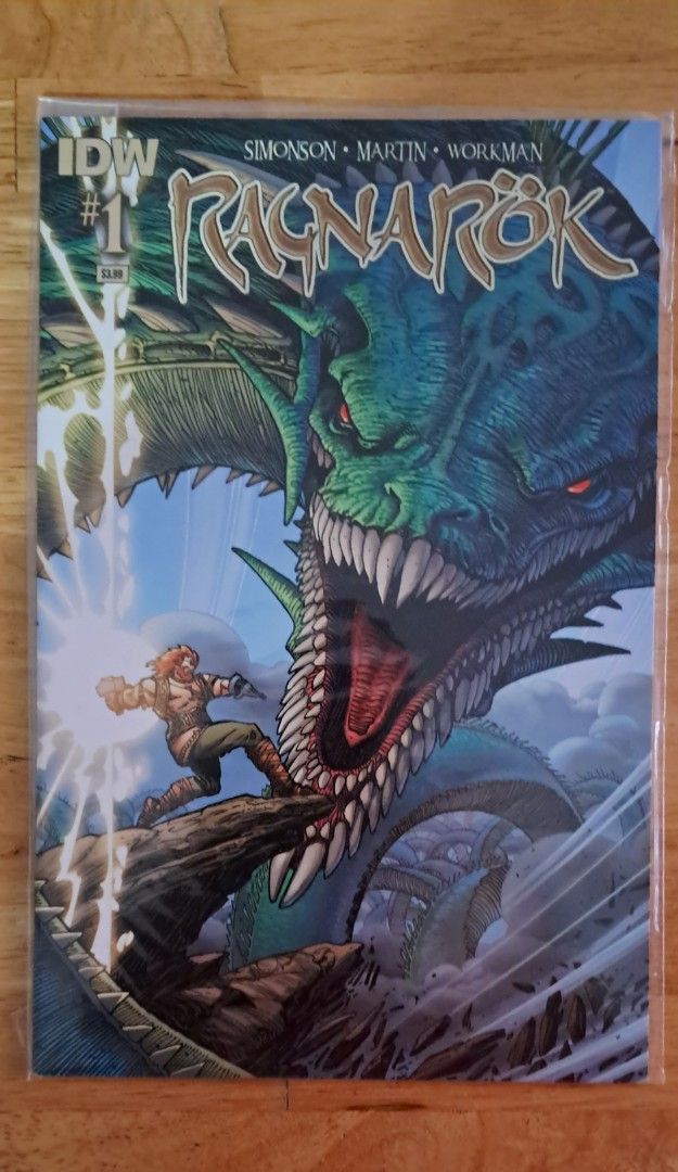 Ragnarok #1 Comic Book (Category: Comics & Manga) located in Quezon City. Submitted by ernestamaru2 (Listing ID 1397641974, Image 1). Description: - Ragnarok #1 comic book - Published by IDW - Features warrior vs. dragon artwork - Includes Simonson, Martin, and Workman - Sealed in a protective sleeve.