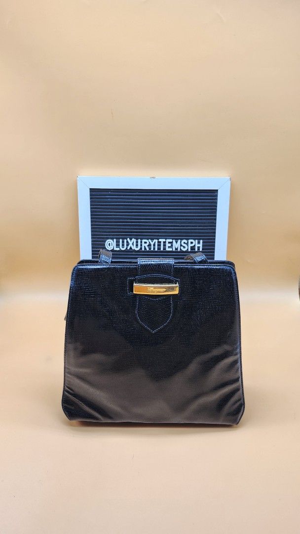 Salvatore Ferragamo Black Sling Bag (Category: Luxury Bags & Wallets) located in Pamplona. Submitted by luxuryitems_ph (Listing ID 1397708731, Image 1). Description: - Salvatore Ferragamo sling bag - Elegant black color - Textured exterior - Gold-tone clasp - Interior mirror - Gold-tone zipper - Long shoulder strap - Made in Italy.