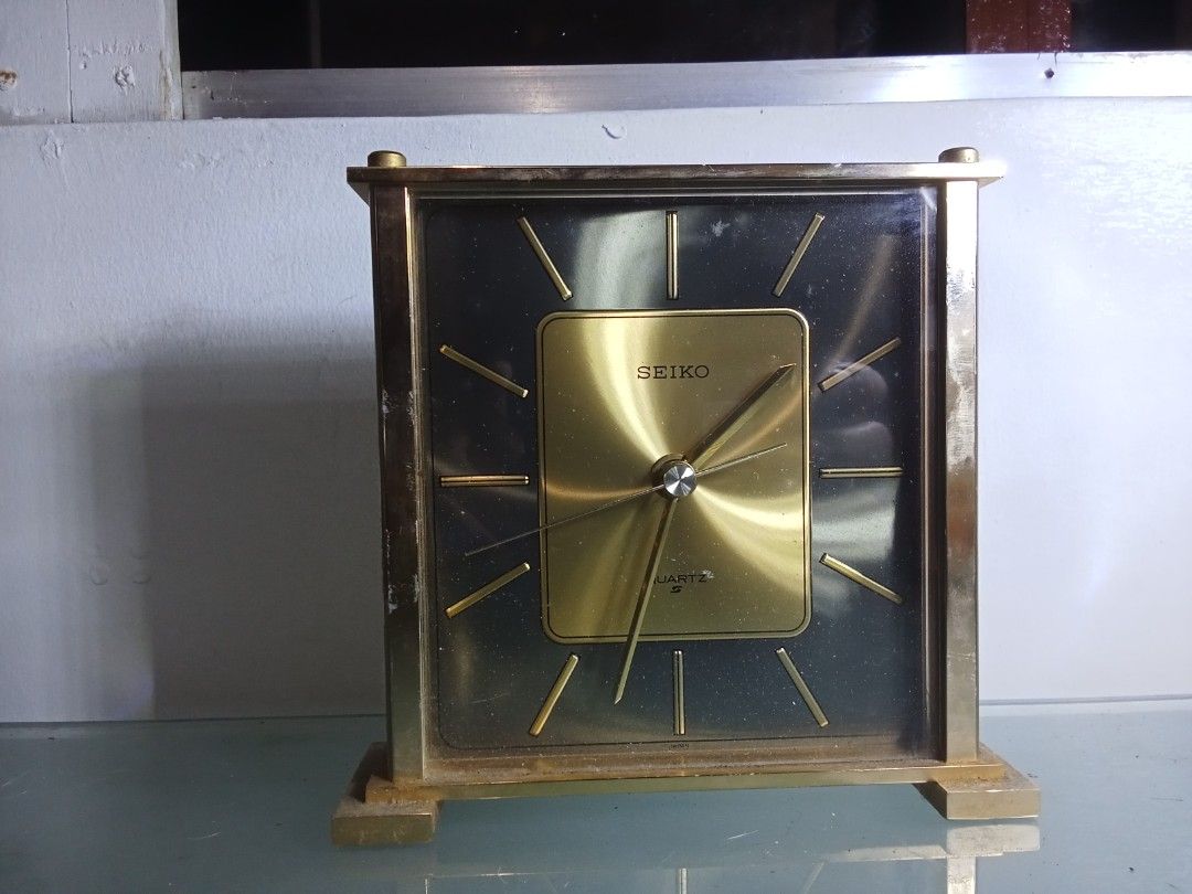 Seiko Quartz Table Clock (Category: Clocks) located in Quezon City. Submitted by jhayjaz08 (Listing ID 1397768835, Image 1). Description: - Vintage Seiko quartz table clock - Gold-colored face - Gold-tone hands and markers - Square gold-colored frame - Seiko quartz movement - In working condition Made in Japan.