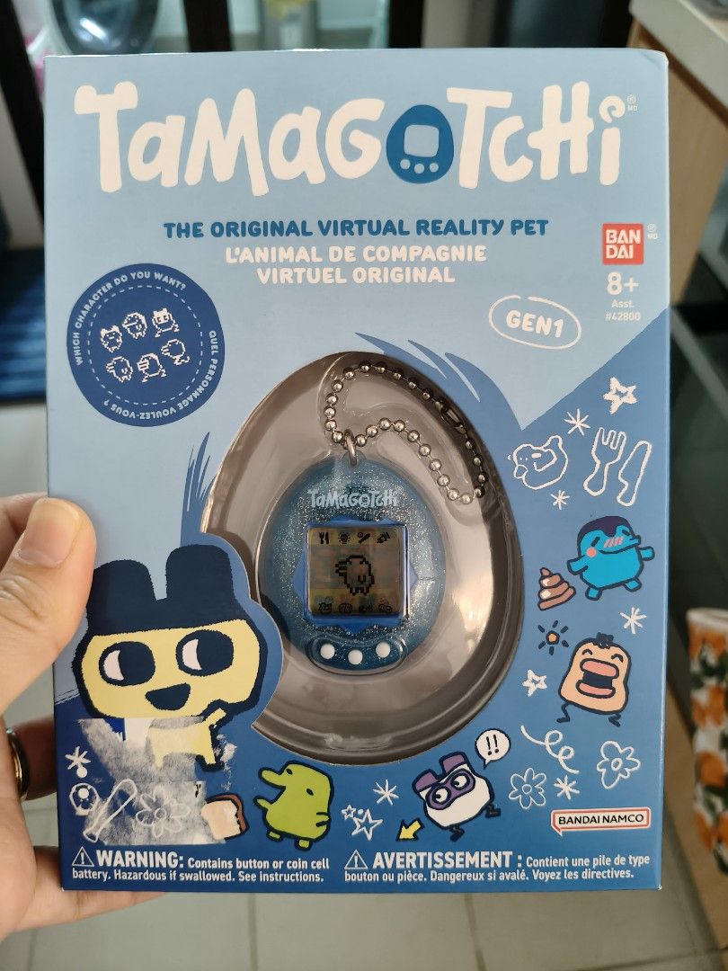 Tamagotchi Gen 1 Virtual Pet - Blue (Category: Interactive Toys) located in Singapore. Submitted by missy-missy (Listing ID 1397651251, Image 1). Description: - Brand new, unopened Tamagotchi Gen 1 - Comes in original packaging - A classic digital pet - Great for collectors - Relive the 90s nostalgia! -brand new in box.