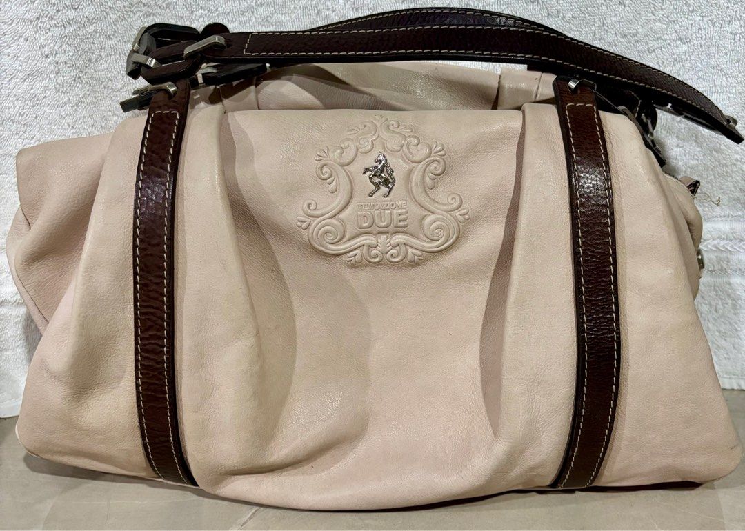 Ladies Shoulder Carry all bag (Category: Shoulder Bags) located in Quezon City. Submitted by clutterfreemom (Listing ID 1397764959, Image 1). Description: TENTAZIONE DUE ITALIAN PINK leather shoulder bag Brown leather straps & trim. Engraved ,brushed nickel hardware. Measurements : 15”L (19” Middle) x 11”H x 5” depth. Leather & metal chain straps have a 12” drop length. Interior : Signature printed ivory satin fabric. Three main compartments - mi