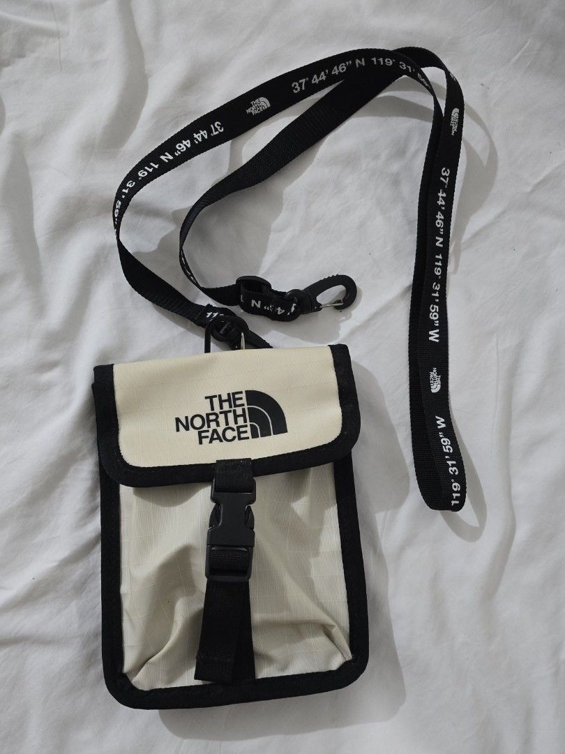 The North Face Crossbody Bag (Category: Backpacks) located in Quezon City. Submitted by smallblackant (Listing ID 1397623431, Image 1). Description: - The North Face crossbody bag. - Color: Cream front with black border - Adjustable strap with coordinates print. sf care of buyer .