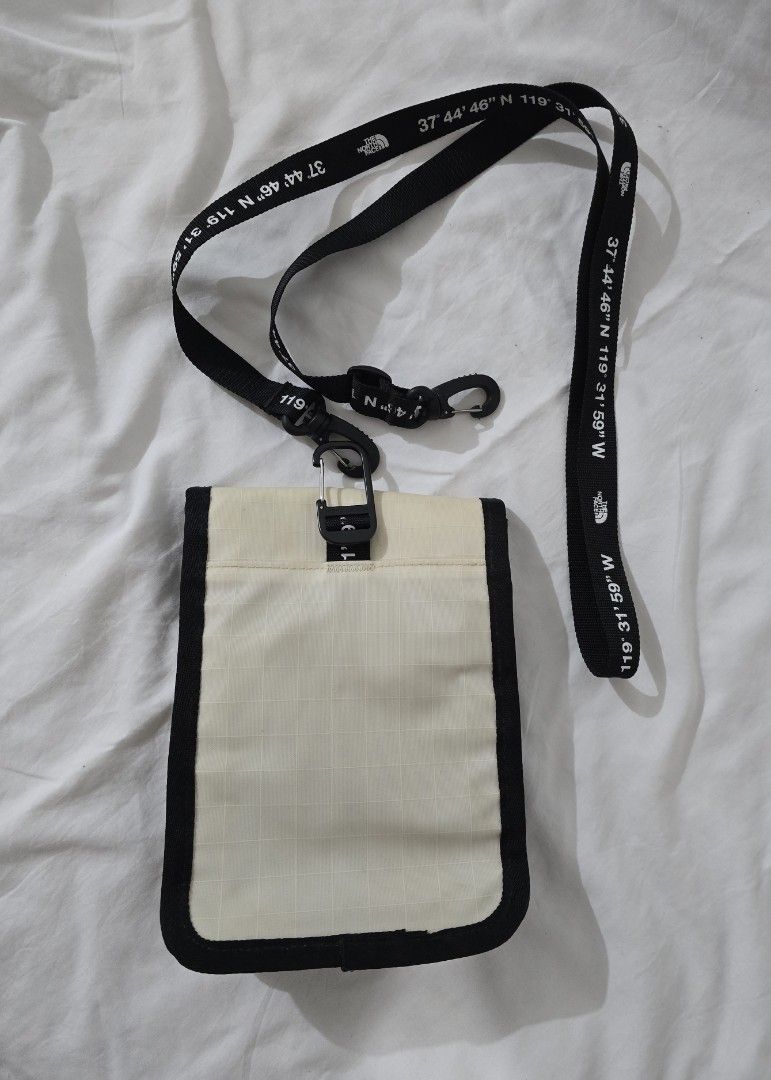 The North Face Crossbody Bag (Category: Backpacks) located in Quezon City. Submitted by smallblackant (Listing ID 1397623431, Image 2). Description: - The North Face crossbody bag. - Color: Cream front with black border - Adjustable strap with coordinates print. sf care of buyer .