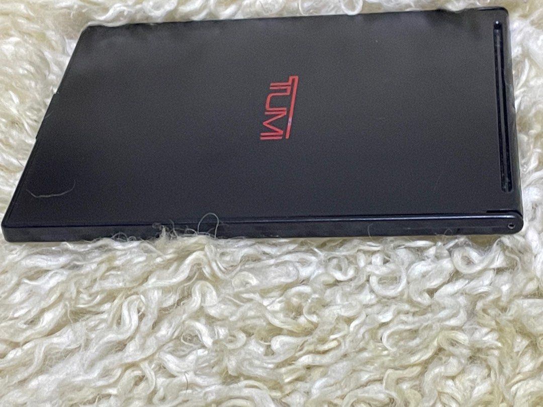 Unused Tumi Foldable Mirror (Category: Mirrors) located in Rosario. Submitted by myvinatgepieces (Listing ID 1397754563, Image 3). Description: Unused Tumi Foldable Mirror With plastic cover Back Portion with minor scratches due to storage No Other Inclusions.