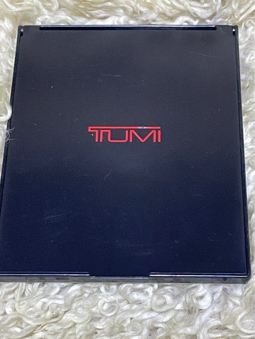 Unused Tumi Foldable Mirror (Category: Mirrors) located in Rosario. Submitted by myvinatgepieces (Listing ID 1397754563, Image 1). Description: Unused Tumi Foldable Mirror With plastic cover Back Portion with minor scratches due to storage No Other Inclusions.