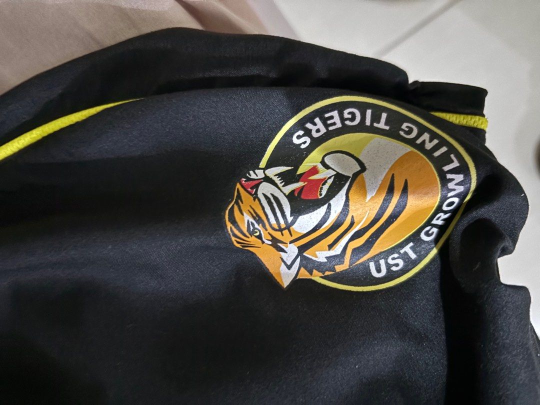 UST Fitness / PATHFIT Uniform Set (Category: Activewear) located in Manila. Submitted by ddeclutterwmeeeee (Listing ID 1397753466, Image 3). Description: PRICE: 400 for the set • can do meet ups around españa / around UST or via lalamove - Fitness uniform set - Shirt: Yellow with black collar, "Fitness" print, size L - Pants: Black with yellow trim, UST Growling Tigers logo, size L .