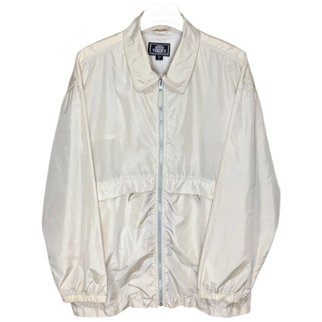 (XL) VERSACE Vintage Men's Windbreaker (Category: Coats, Jackets and Outerwear) located in Baguio. Submitted by db_clothing (Listing ID 1397719984, Image 1). Description: ISSUE: STAINS - SCRATCHES(2ND PHOTO) Dimensions: Width: 25 inches Length: 30 inches Shoulder: 23 inches Sleeve: 23 inches.