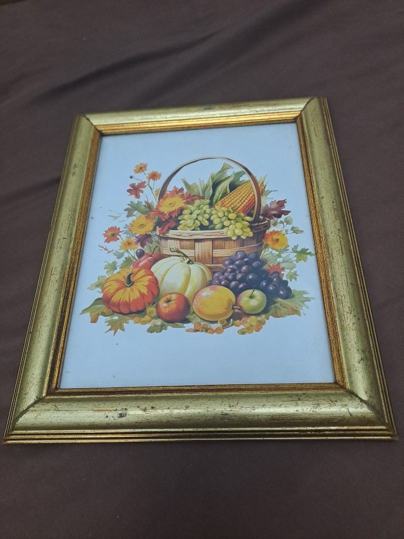 Vintage Harvest Picture Frame (Category: Frames & Pictures) located in Manila. Submitted by joanbalde39643 (Listing ID 1397765565, Image 1). Description: - Vintage picture frame - Features a colorful harvest scene - Gold-colored finish - Black backing - Includes hanging hardware - Ready to display.