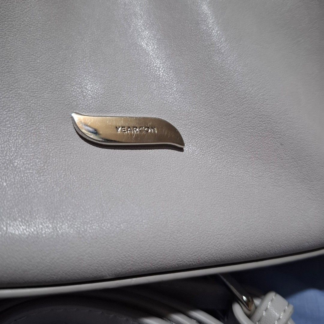 Yearcon Bag (Category: Cross-body Bags) located in Manila. Submitted by mdc08 (Listing ID 1397588675, Image 2). Description: ▪︎Brand new, no tags ▪︎MPO per source (please manage expectations) ▪︎Small, very cute and unique ▪︎Leather with fabric lining; comes with belt-type, adjustable strap ▪︎Silver hardware ▪︎Main compartment with zipper and magnetic closure, 1 zippered pocket ▪︎Dimensions: L 22 x H 14 x W 7.5 cm Reason(s) for Selling: ▪︎Change o