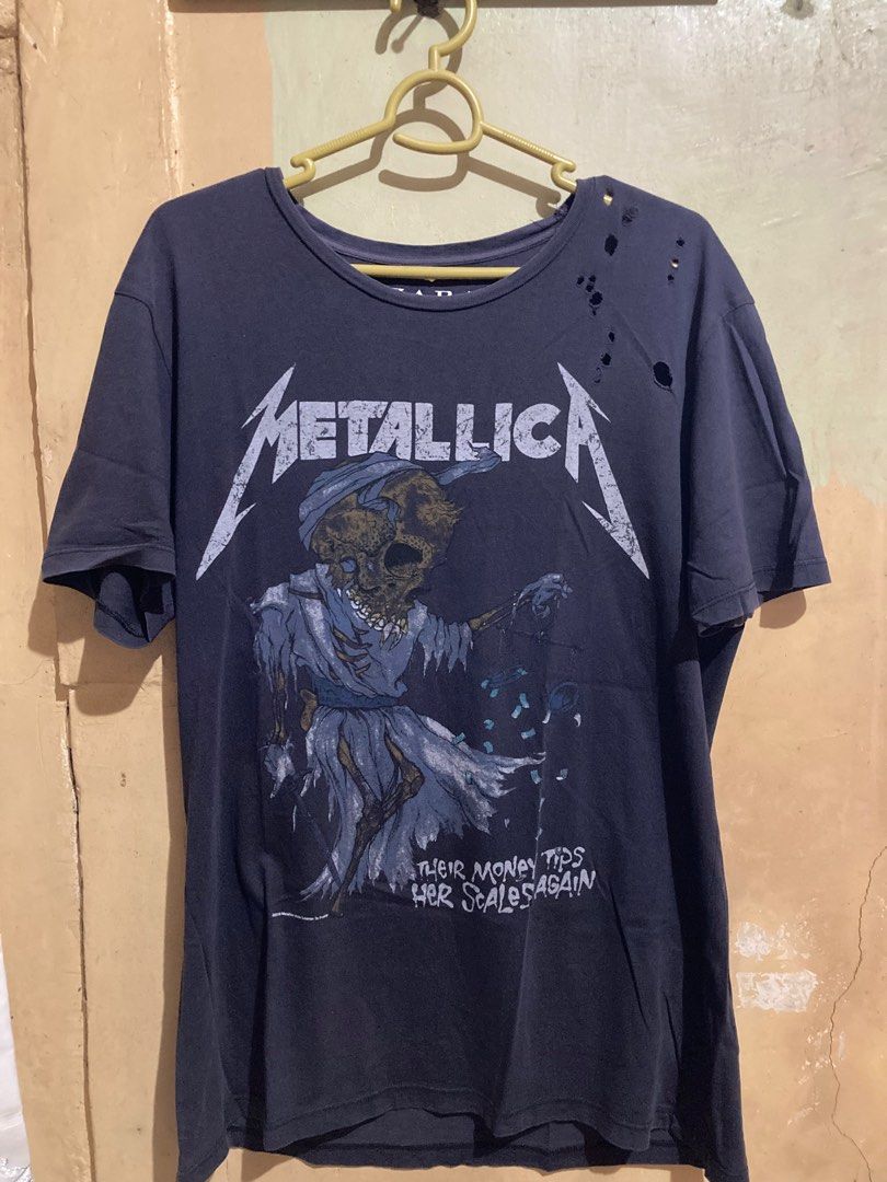 Zara Metallica distressed Style Tee (Category: Tshirts & Polo Shirts ) located in Caloocan City. Submitted by binsbinss (Listing ID 1397637295, Image 1). Description: - Zara Metallica graphic t-shirt - Dark gray color - Size L - Distressed design with holes on the upper left shoulder.