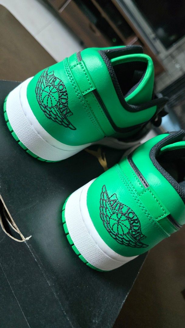 Air Jordan 1 Low Lucky Green (Category: Sneakers) located in San Juan City. Submitted by aivveee (Listing ID 1397814646, Image 3). Description: - Air Jordan 1 Low sneakers - Green and black colorway - Iconic Air Jordan wings logo on the heel - White midsole - Green outsole - Comes with the original box - Size information available on the box.
