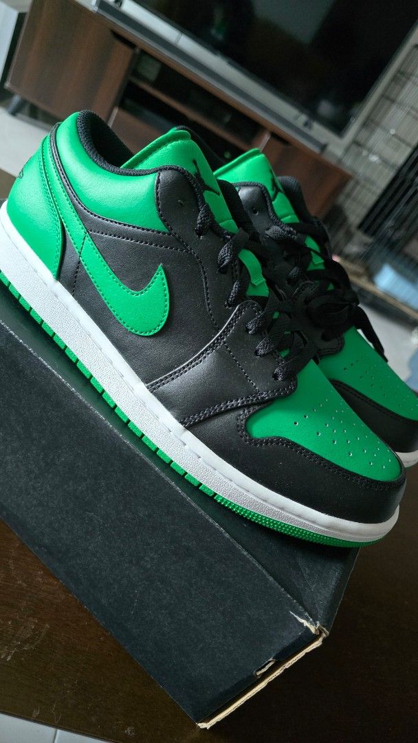 Air Jordan 1 Low Lucky Green (Category: Sneakers) located in San Juan City. Submitted by aivveee (Listing ID 1397814646, Image 1). Description: - Air Jordan 1 Low sneakers - Green and black colorway - Iconic Air Jordan wings logo on the heel - White midsole - Green outsole - Comes with the original box - Size information available on the box.