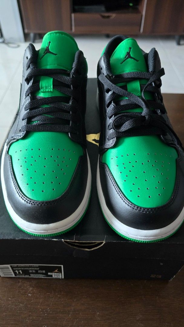Air Jordan 1 Low Lucky Green (Category: Sneakers) located in San Juan City. Submitted by aivveee (Listing ID 1397814646, Image 2). Description: - Air Jordan 1 Low sneakers - Green and black colorway - Iconic Air Jordan wings logo on the heel - White midsole - Green outsole - Comes with the original box - Size information available on the box.