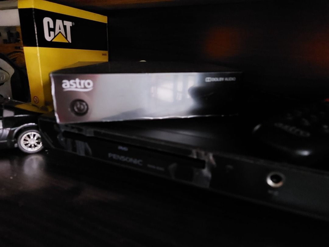 Astro Receiver / decoder (Category: TV Parts & Accessories) located in Skudai. Submitted by ats1989 (Listing ID 1397909733, Image 1). Description: - Astro receiver - Features Dolby Audio - Power button and Astro logo on front - Paired with a Pensonic DVD player.