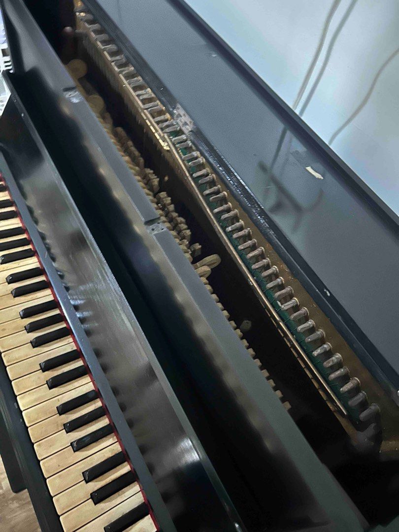Black Upright Piano with Bench (Category: Musical Instruments) located in Makati City. Submitted by nicesantos12 (Listing ID 1397894880, Image 2). Description: - Black upright piano - Includes matching bench - Full keyboard - Black finish - antique (70’s) but had body fixed - just needs tuning Length is 33inches Height 35inches Depth is 15inches.