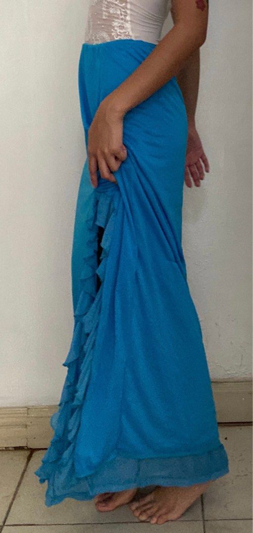 Blue Ruffle Maxi Skirt (Category: Skirts) located in Manila. Submitted by raspberryfurs (Listing ID 1397823564, Image 1). Description: - Vibrant blue maxi skirt - High-waisted design - Features a stylish ruffle detail - Elegant side slit - Floor-length - Made of lightweight fabric, ideal for warm weather.