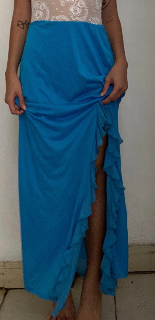 Blue Ruffle Maxi Skirt (Category: Skirts) located in Manila. Submitted by raspberryfurs (Listing ID 1397823564, Image 2). Description: - Vibrant blue maxi skirt - High-waisted design - Features a stylish ruffle detail - Elegant side slit - Floor-length - Made of lightweight fabric, ideal for warm weather.