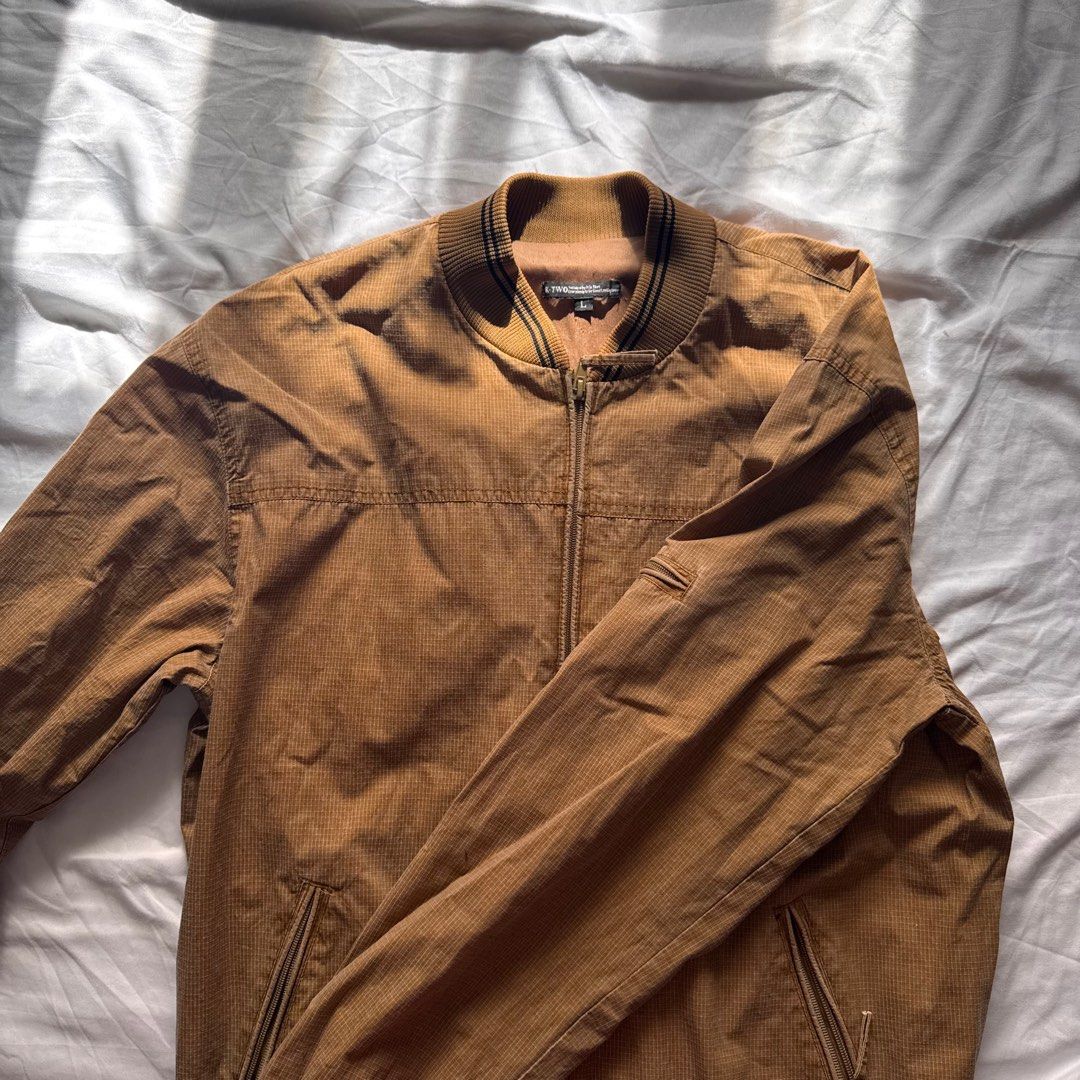 Brown Bomber Jacket | L-XL (Category: Coats, Jackets and Outerwear) located in Manila. Submitted by helloitsjan (Listing ID 1397844568, Image 2). Description: - Brown bomber jacket - Full zip closure - Ribbed collar, cuffs, and hem - Two front pockets - Textured pattern - Perfect for layering.