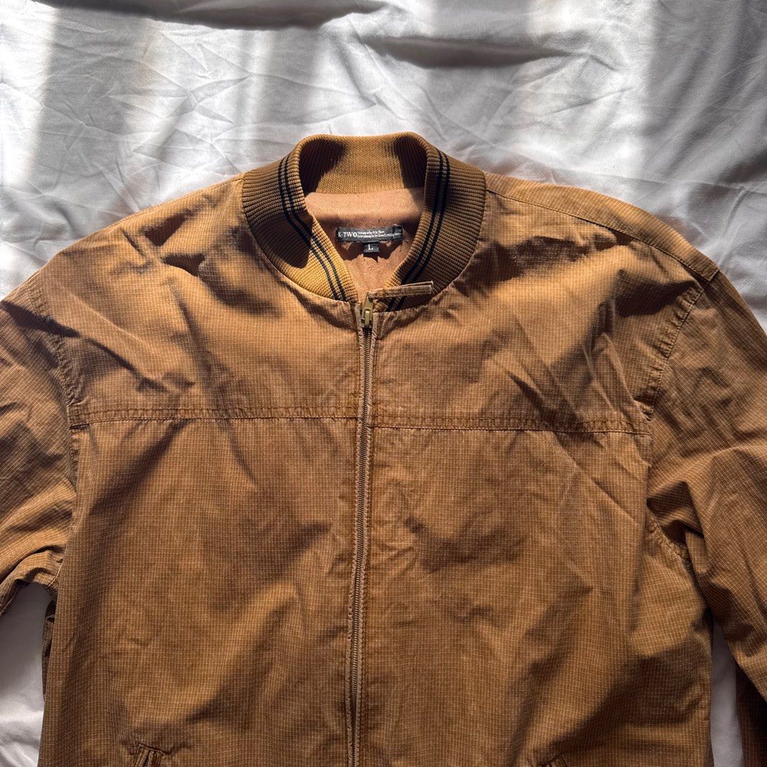 Brown Bomber Jacket | L-XL (Category: Coats, Jackets and Outerwear) located in Manila. Submitted by helloitsjan (Listing ID 1397844568, Image 1). Description: - Brown bomber jacket - Full zip closure - Ribbed collar, cuffs, and hem - Two front pockets - Textured pattern - Perfect for layering.