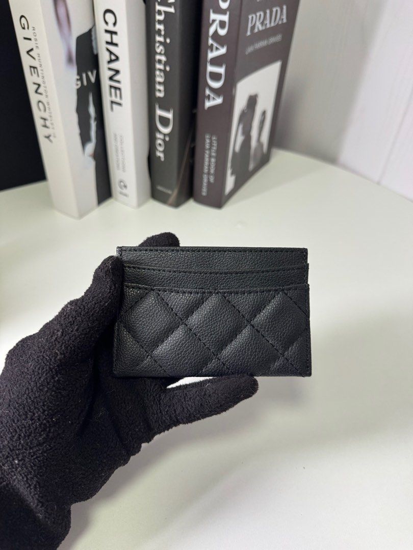 Chanel Quilted Card Holder (Category: Luxury Bags & Wallets) located in Baguio. Submitted by luxe2600 (Listing ID 1397971669, Image 2). Description: GWP - Chanel card holder - Black leather - Quilted design - Iconic CC logo - Multiple card slots - Black interior - Stylish and classic accessory.