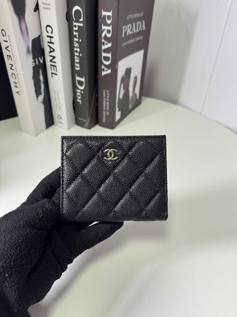 Chanel Quilted Leather Wallet (Category: Luxury Bags & Wallets) located in Baguio. Submitted by luxe2600 (Listing ID 1397971710, Image 1). Description: GWP - Authentic Chanel wallet - Black quilted leather exterior - Secure snap closure - Multiple card and cash compartments - Compact design - Features the iconic Chanel logo.